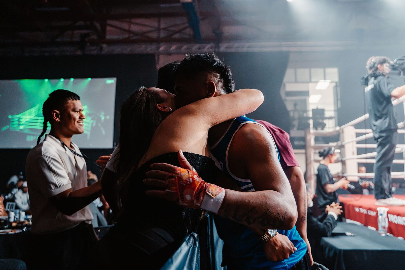 Ringside embrace after the final bell